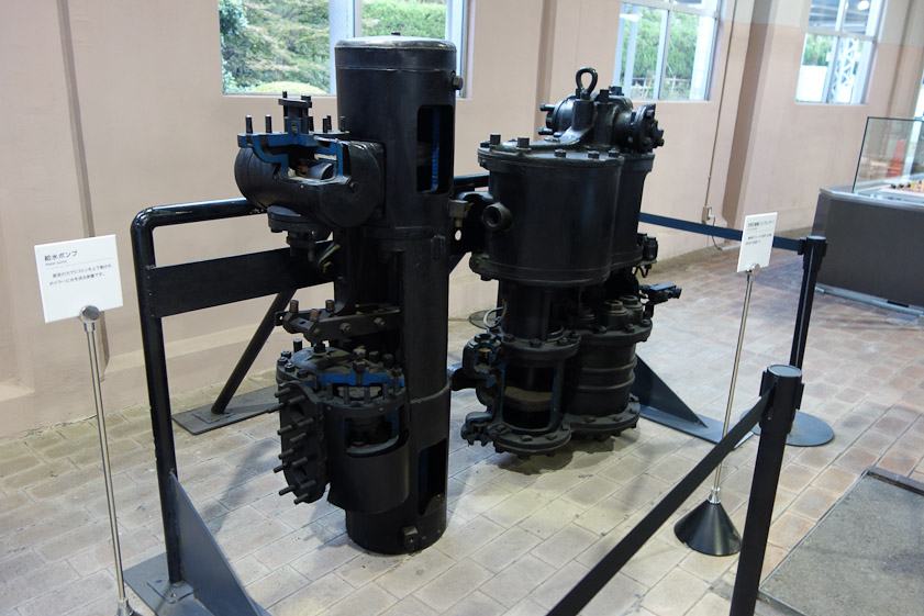 A water pump (left) and air compressor (right). To replace water conveerted to steam, water must be pumped at high pressure into the boiler, which is at 200-300 psi. The compressor powers the brakes on some trains. On others, the brakes use a vacuum.