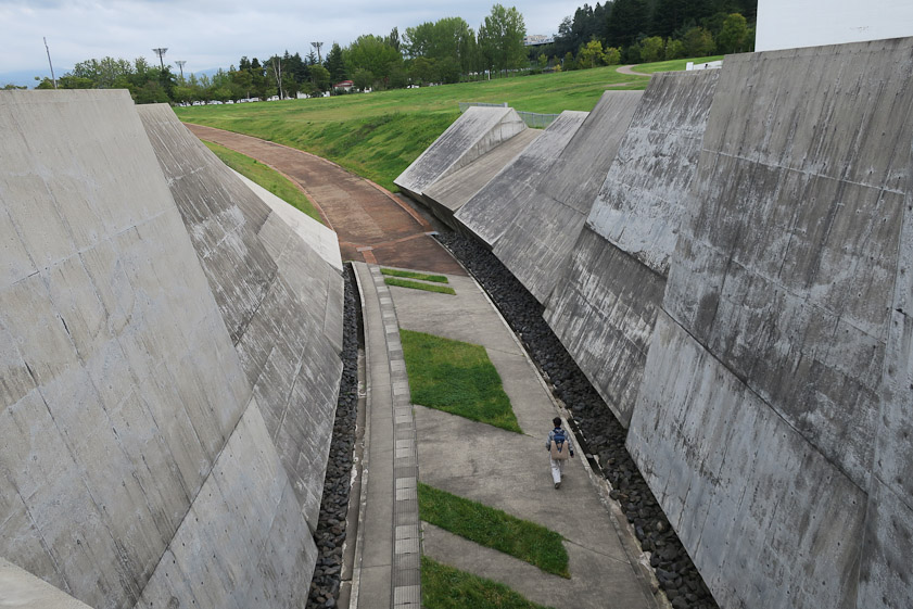 A road passing in front of the museum was sunken and lined with huge slabs of concrete.