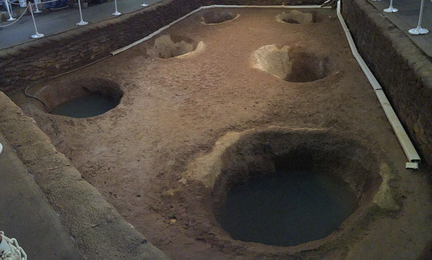 These six holes were discovered during excations. Their diameter indicated the diameter of the posts that had filled them, and the soil compaction indicated the height of the posts.
