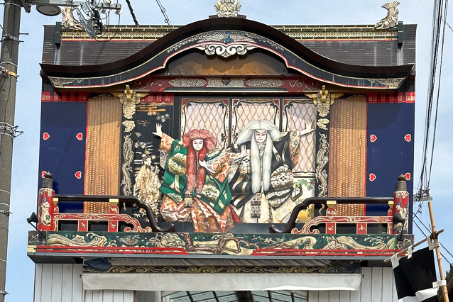 This depicats a stage such as carried by floats in the local festival.