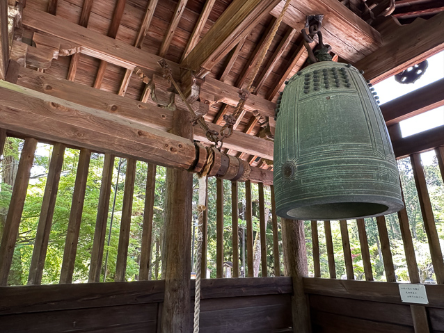 The log hanging from the belfry fram could be swung by visitors to ring the brll.