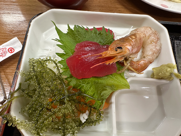 Some kind of seaweed, sashini, and a big shrimp