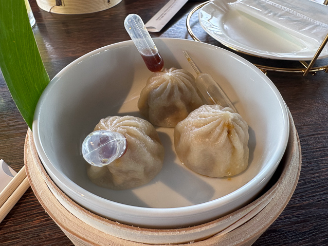 At the restaurant adjoining the garden we had dumplings with little ampules of sauce to inject.