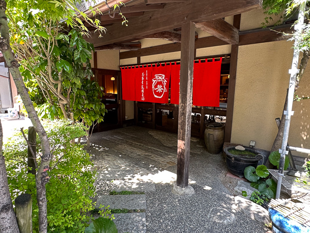 The shop is in the groind floor of a 10-story apartmrnt in a small side street/