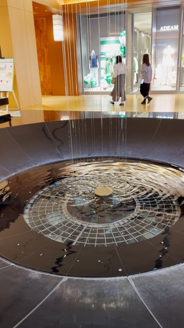 This fountain at the entrance to Tokyo Midtown featured streams of water two stories long.