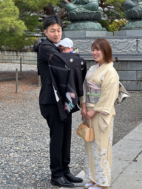 They brought their baby to a shrine or temple at Zenkoji for some ritual.
