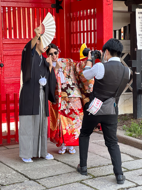 In Japan newly married couples are photographed in various locations in the city. These are not completely traditional poses..