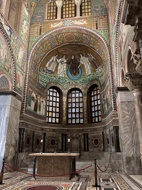 The altar stands in front of the  preybetery with the bishop's chair dimly misible on the far wall of the apse.