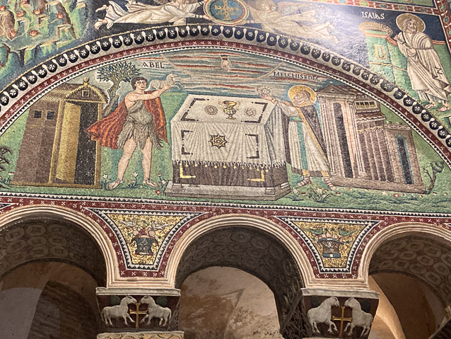 Abel (left) and Melchisedec (right) make offerinfs to God, whose hand extends down from the clouds. Why these two stories from Genesis are shown togrther is uncertain.