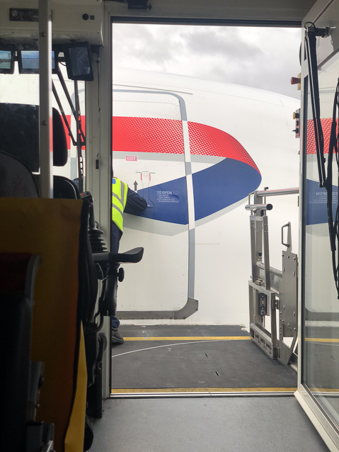 The transporter driver knocked to signal the stewardess to open the door, and we rolled through the galley to get to our seats.