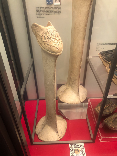 These shoes, or stilts, were worn by Venitian ladies under long skirts as a fashion in late 15c. They were also used in Hispano-Moorish and Turkish areas.