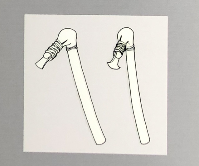 Drawing showing axe heads atteched to handles.