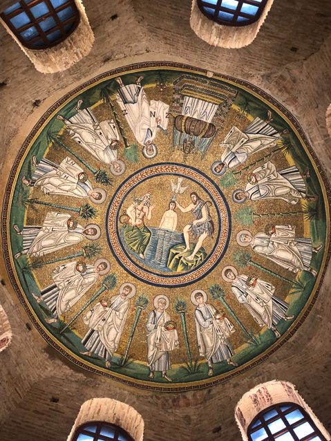 The only decoration remaining from Theodoric's time is this wonderful mosaic in the vault  showing Jesus being baptized by John the Baptist in the River Jordan symbolized by the beard man on the left. The 12 Apostles move to the right and to the let around the naptism, meeting at the top.