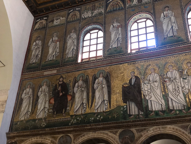 The south procession of martys is led by Saint Martin with gifts to Jesus.