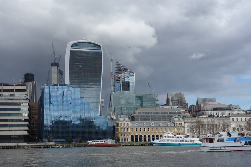 The tourist boat is tied up in front of the arcades of Old Billingsgate, built in 1875 as a fish market