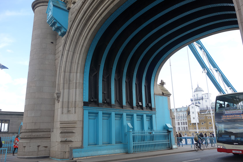 The beams supporting the arch under the tower are riveted, unlike modern welded beams.