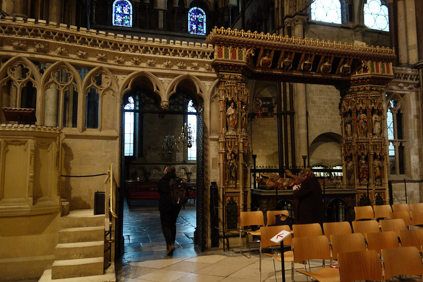 The exit from the choir into the north choir aisle passes an elaborate tomb on the right.