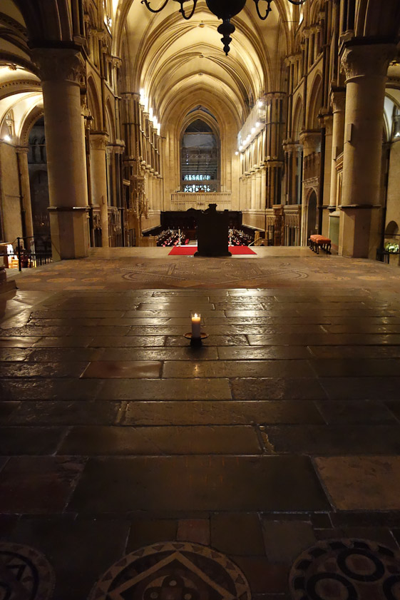 This view is west through the whole church to the west windows. The candle marks where the shrine to Becket stood, not where he was killed.