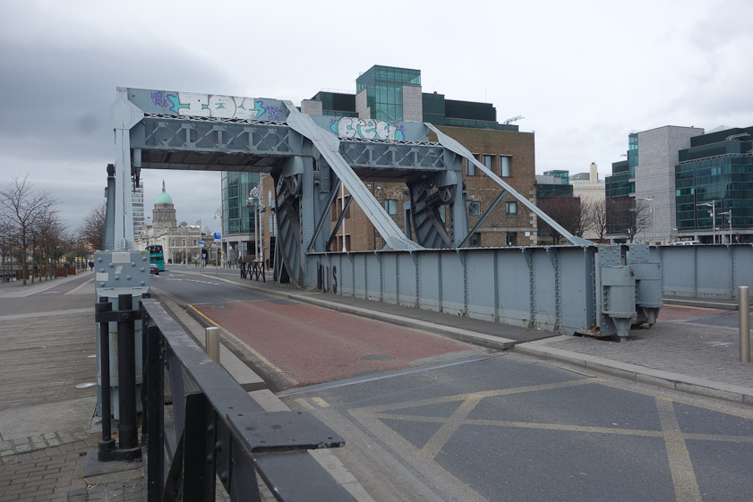 The left bridge carries west-bound road traffic, the right bridge east-bound traffic. These bridges must be permanently closed now, since pavement to the right and left would block the channel even if the bridges raised.