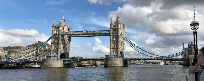 Tower Bridge was built 1886-94 with two suspension spans separated by a draw span. The walkway connecting the tops of the towers opposes the tension in the two suspension chains.