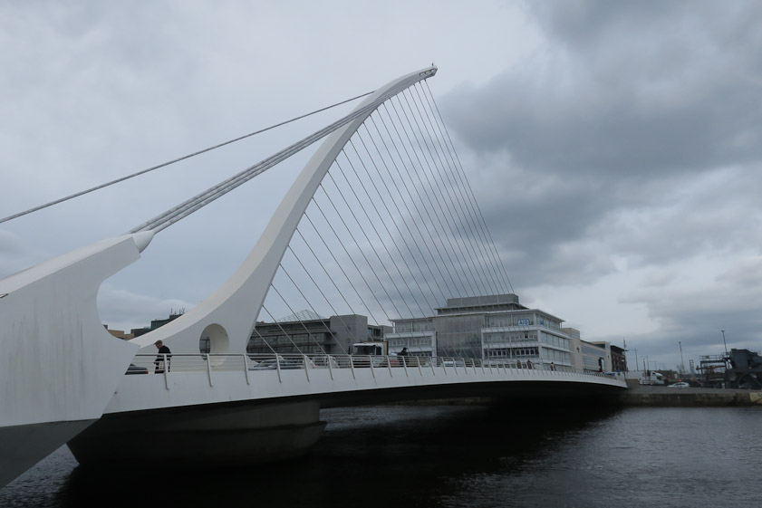 The bridge opens by rotating to the right about a pier near the base of the mast. See https://www.youtube.com/watch?v=CBIgFg_SoDM but turn off the sound.
