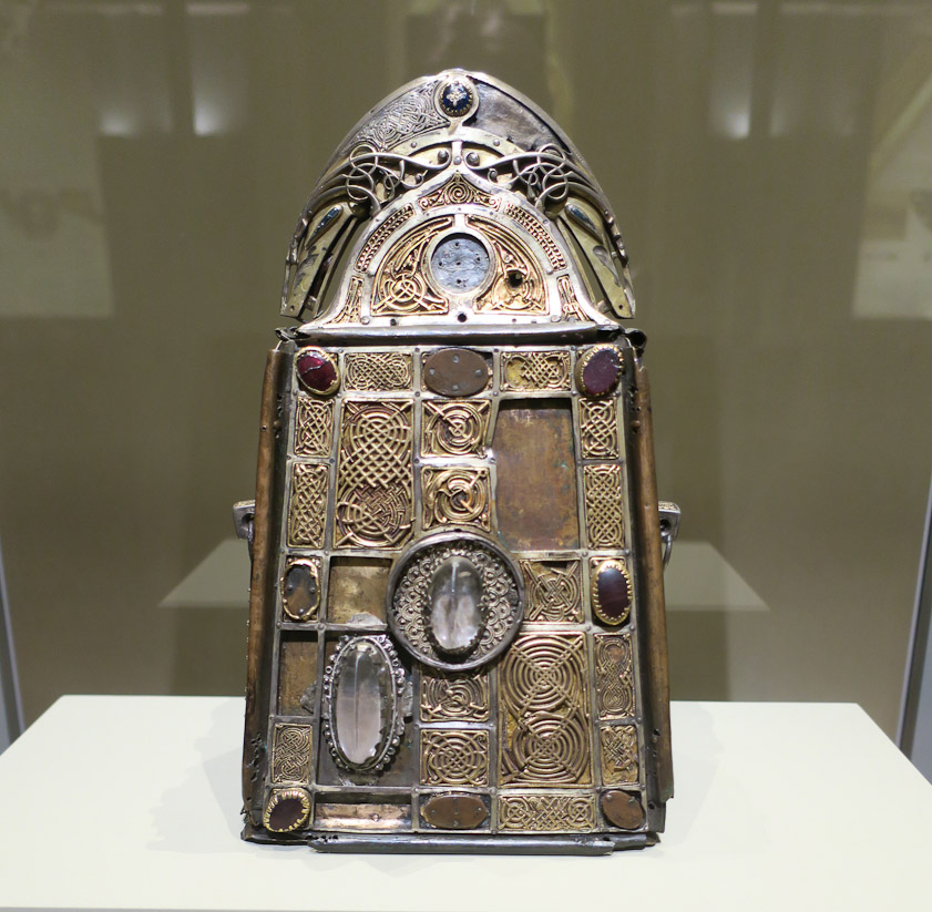 Saint Patrick's Bell and Shrine. 6-8 century AD and 1100 AD. The bell is an unarnamented cow bell housed in this precious case. The interlace and spirals seen here also were used in the Book of Kells.