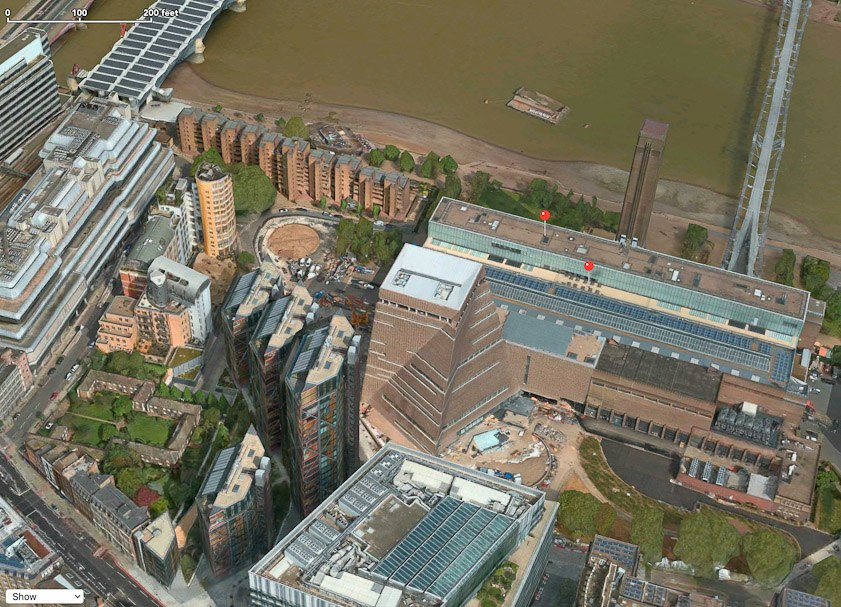 This aerial view of the Tate Modern and its neighbors to the west shows the Millenium Bridge top right and the photovoltaic roof over Blackfriars Railway Bridge at top left. The four hexagonal towers in middle left are NEO Bankside.