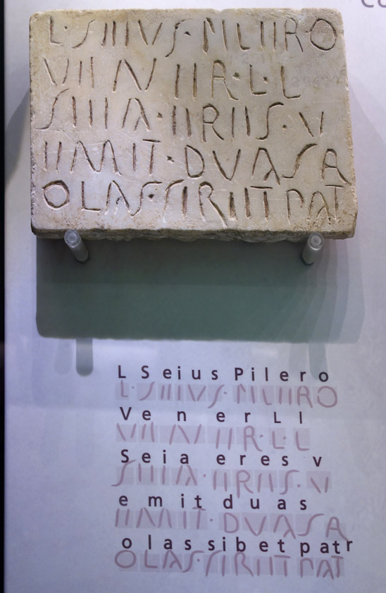 This example of cursive inscription differs from the more formal, careful, skilled inscriptions in several waysl: No serifs. No variation in line width. Irregular character height. S is less completely curved.