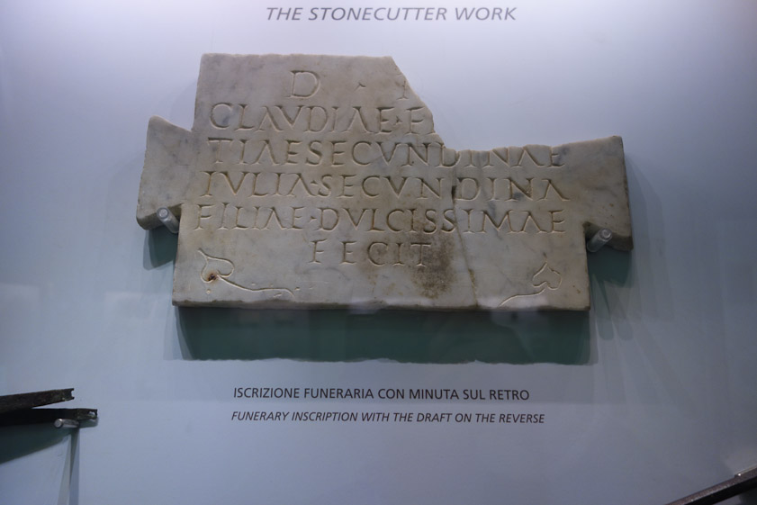 Another funerary inscription with similar lettering.