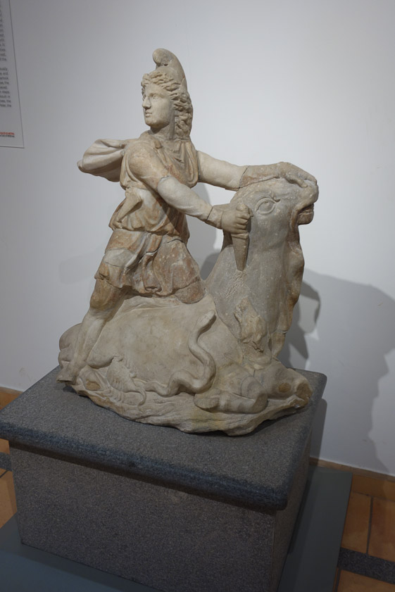 The cult of Mithra originated in Iran and appeared in Rome in the 2d half of 1c AD in modified form. The central episode of the myth is that Mithras seizes a bull by the nostrils and plunges a knife into its side while a dog licks its blood near a serpent and a raven and a scorpion chops off the genitals of the bull, from whose tail wheat ears emerge. (No, it makes no sense!)