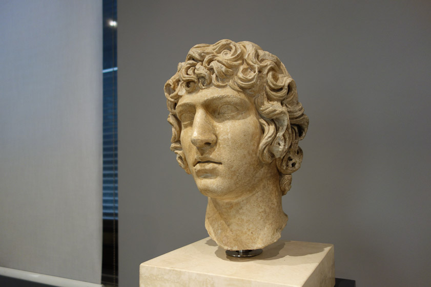 A head of Antinous, a favorite of the Emperor Hadrian. From Tivoli. 130-138 AD.