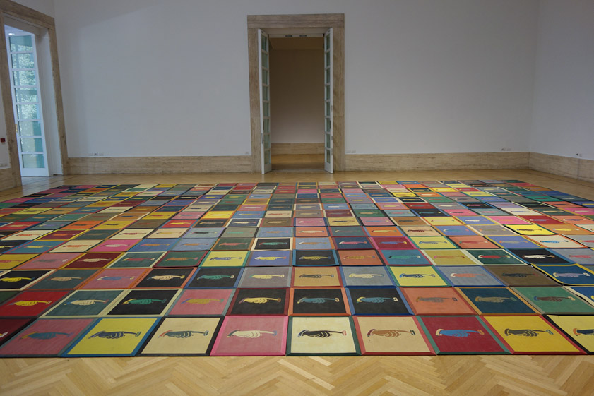 A room covered with carpet squares. 