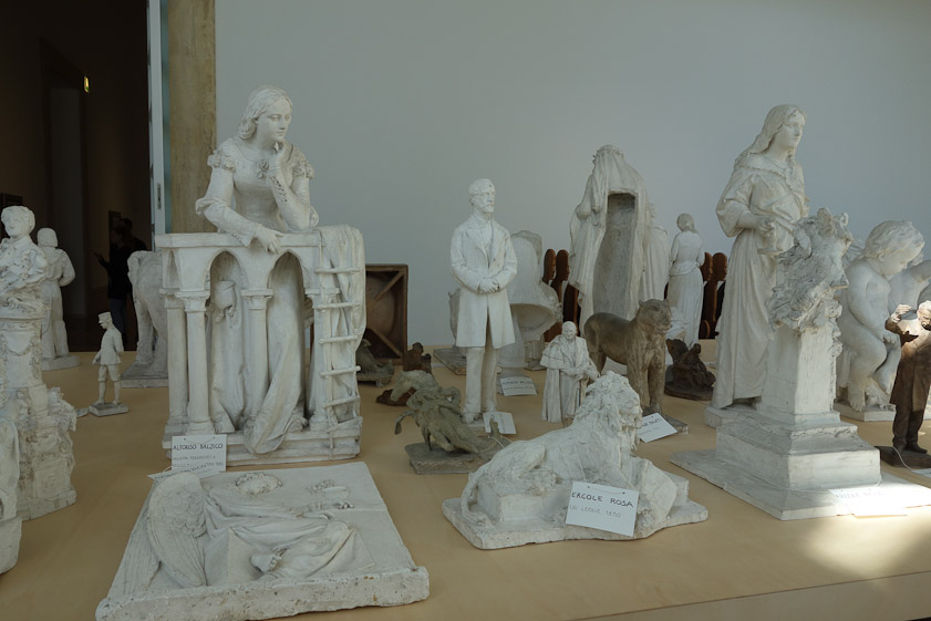 A collection of subscale models of sculpture.
