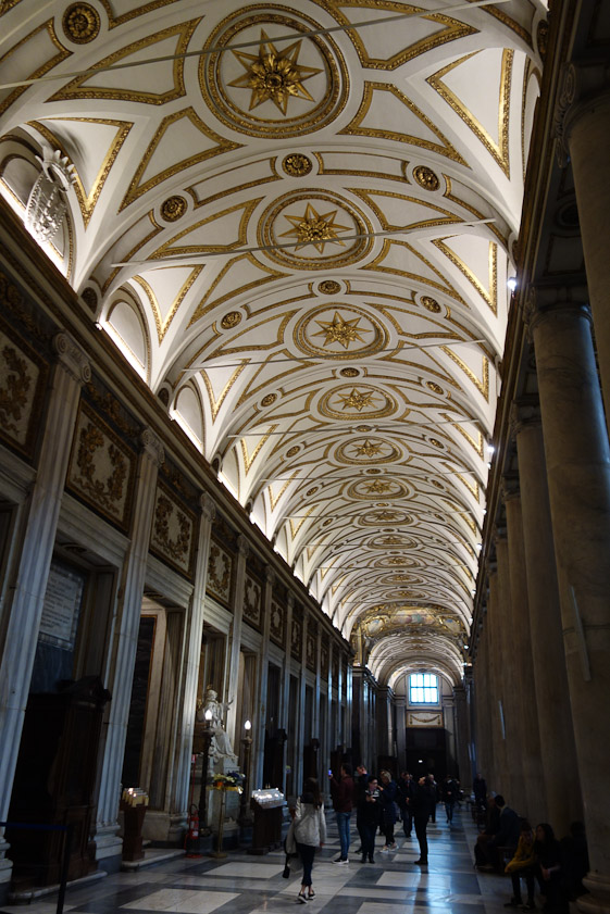 The aisle is vauted in gold and white.