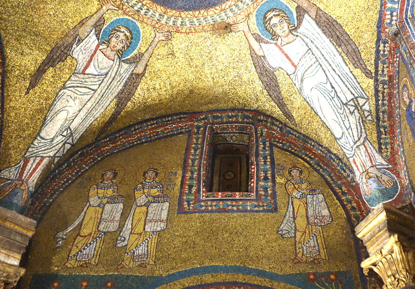 Left to right, Saints Agnes, Pudentiana, and Praxedes hold their crowns with covered hands.