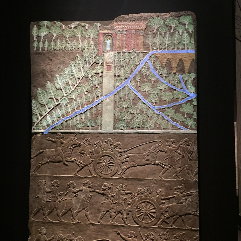 The city in the upper segment is probably Nineveh, with canals colored in blue with colored light in the exhibition.