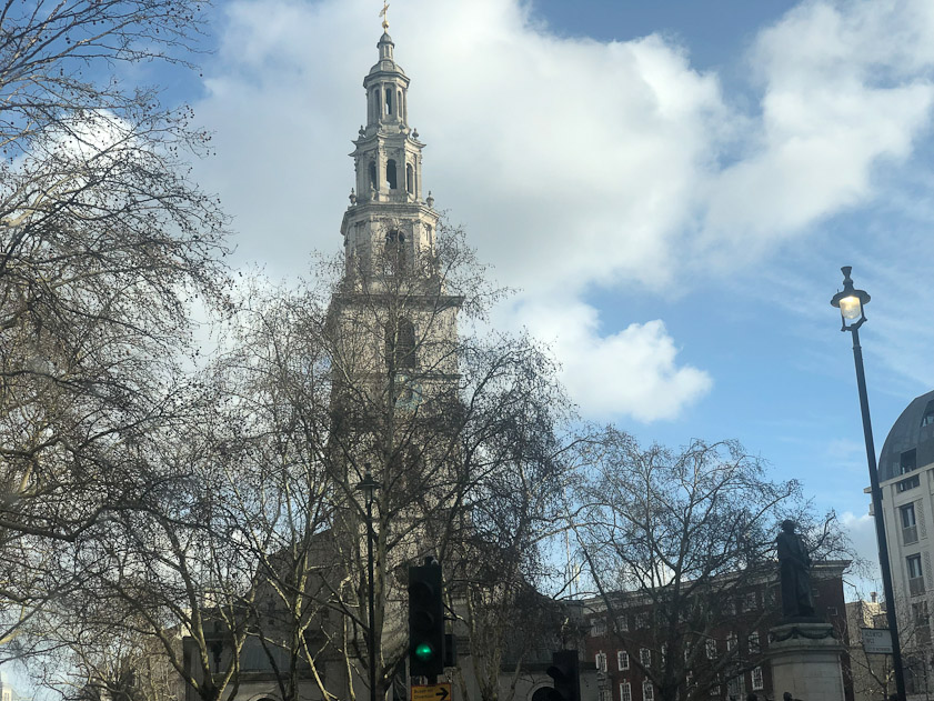 A glimpse of St. CLement Danes. The first church on the site was reputedly founded in the 9th century by the Danes, and the current building was completed in 1682 by Sir Christopher Wren. Gutted during the Blitz, it was restored in 1958, when it became the central church of the Royal Air Force.