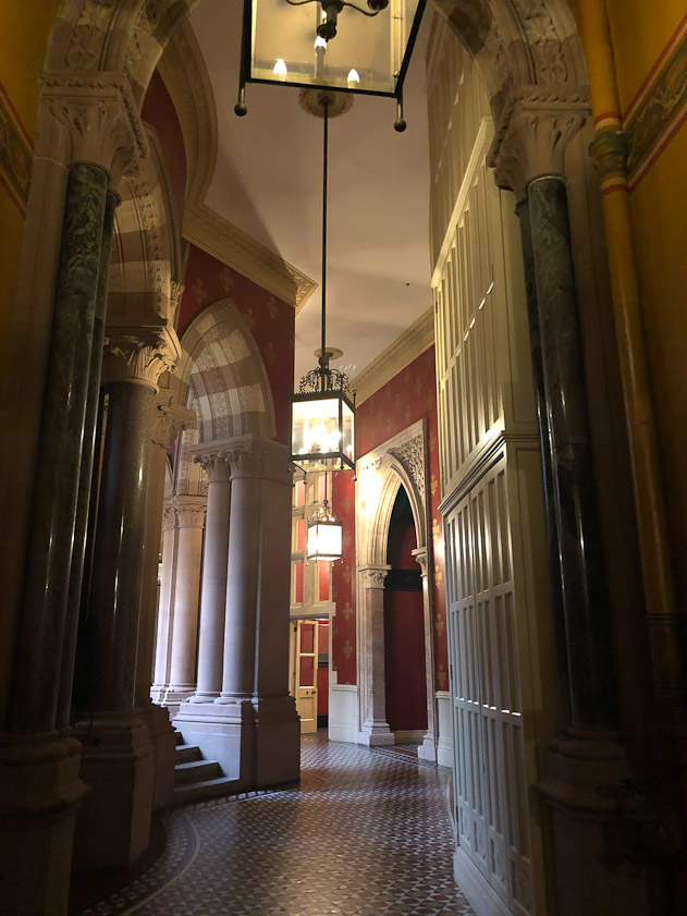 The corridor outside the dining room is ornate.