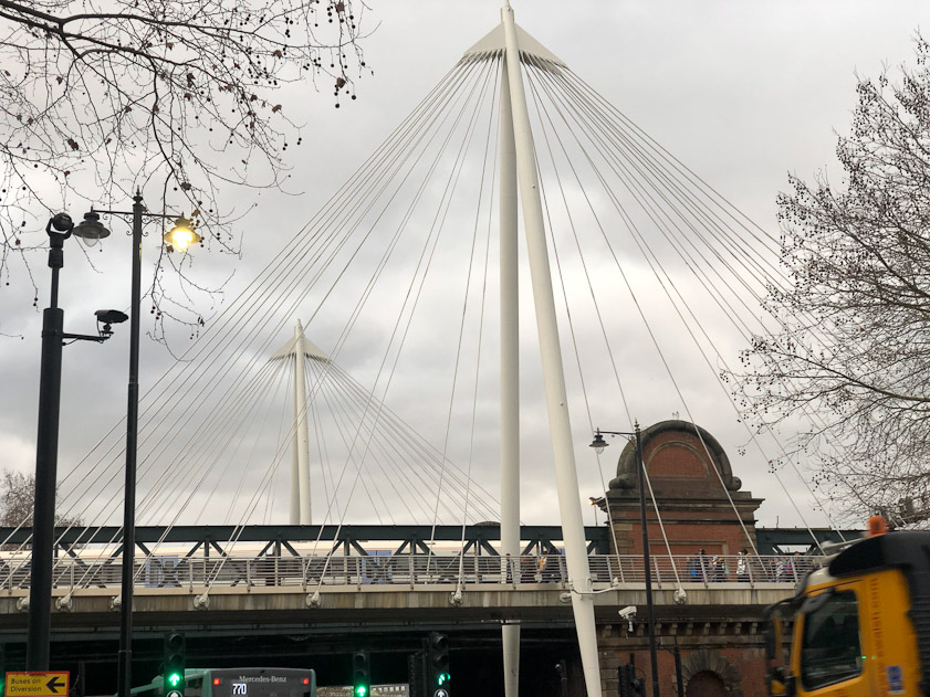 They've added two cable stayed pedestrian bridges on either side of Hungerford Bridge that carries the railroad from Charing Cross station south over the Thames.