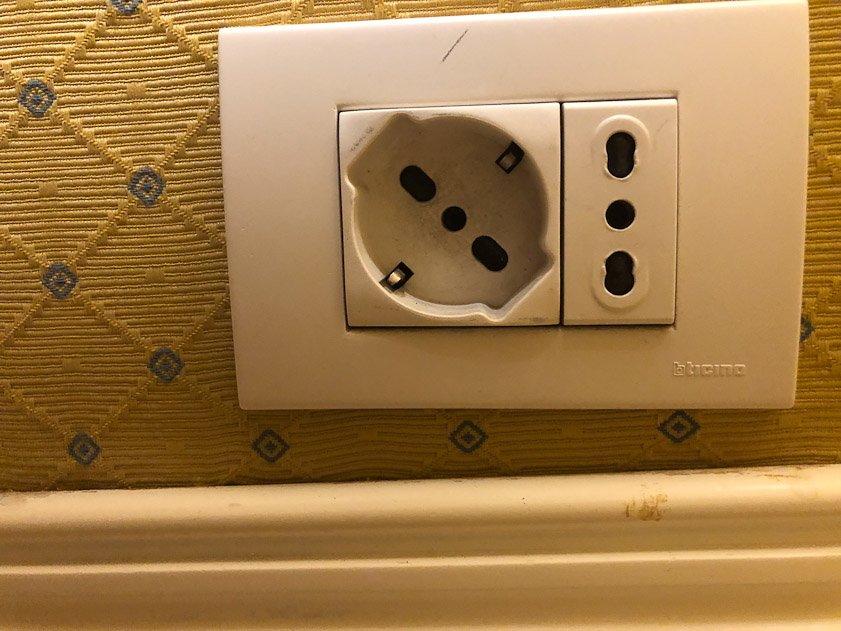 The room had inconvenient electrical outlets with a central ground plug. I had to borrow adapters from the hotel to accomodate the power supplies for our phones and cameras.