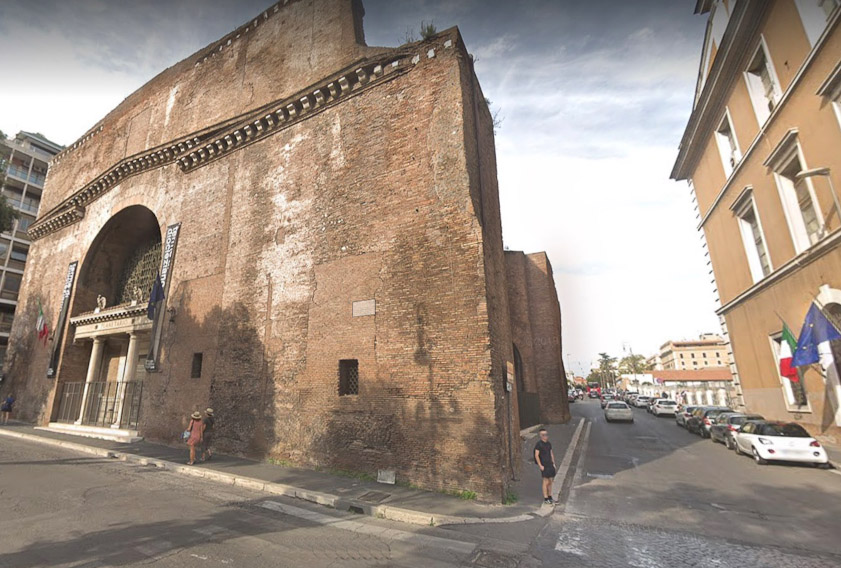 This is the entrance to Via Cernaia, the narrow road on the left side of the Baths. The building on the left was used in modern times as a planaterium. It was the Laconicum, labeled 