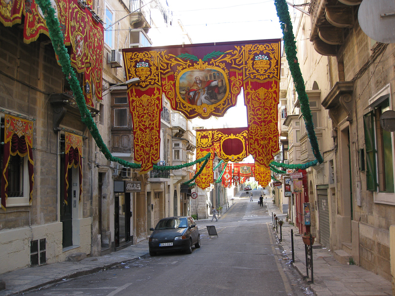 Street decorations in Floriana for the Feast of St. Publius on 21 April. Floriana is adjacent to Valletta, separated from it by the Great Ditch dug as part of the fortifications of Valletta built at the end of the 16c, after the Great Siege of 1565. Floriiana was fortified in the 17c.