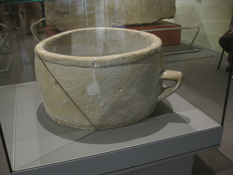 This looks like a cup, but it has no bottom and is much too large to be picked up by its 