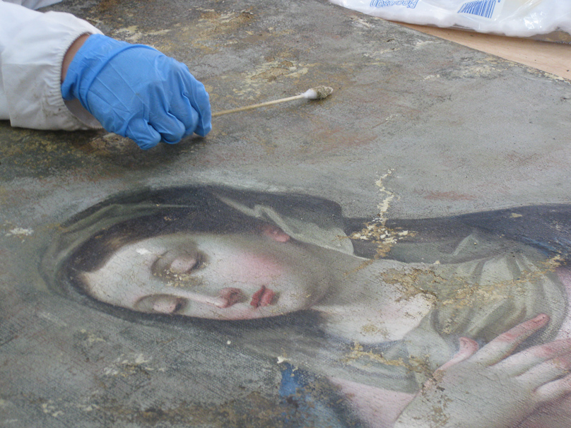 Restorer removing disintegrating overpainting at Heritage Malta workshop at Villa Bighi, the former naval hospital. We came here after lunch at Hagar Qim.