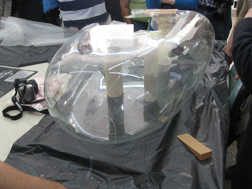 Students were practicing conservation of glass by reassembling a large glass dome. The seams are almost invisible.