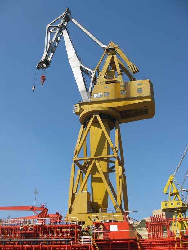 Crane in Grand Harbor towering above a tanker.