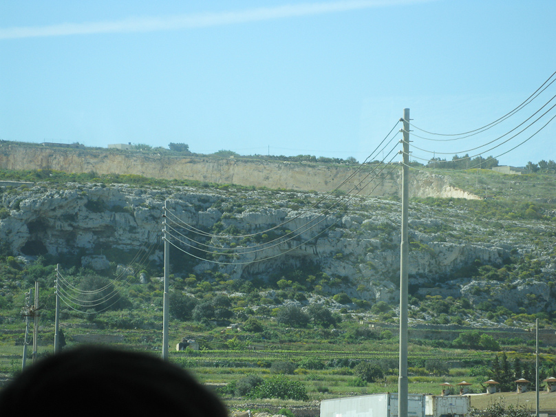 This is the Parabolic Wall. Sound from aircraft approaching from the direction of Sicily was focussed by the wall to microphones which measured the direction to within +/- 2.5  degrees at a range of 21-37 miles. Similar facilities were built in southern England but were superseded by radar.