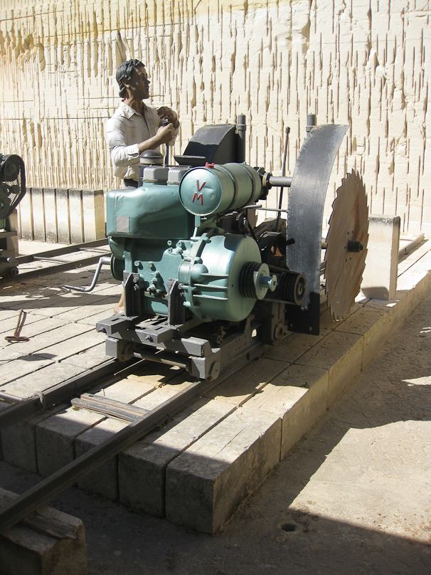 A display at Limestone Heritage, a private museum showing the process of quarrying. The saw cut stone, moving forward on rails.
