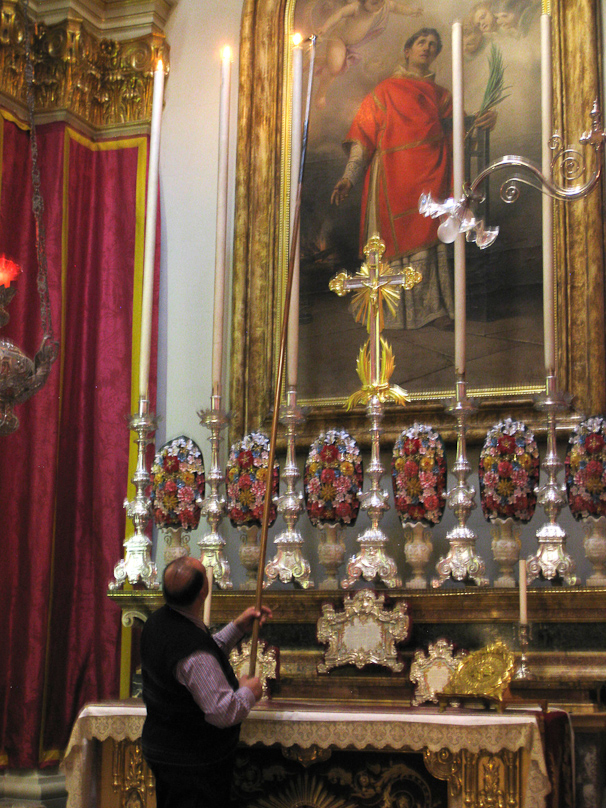 Very tall candles in St. Publius take a very long candle lighter and a steady arm.