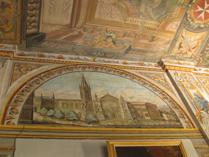 There are history paintings in the lunettes in the hallway.